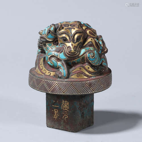 A turquoise-inlaid bronze dragon ornament