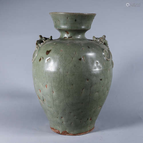 A celadon glazed dragon porcelain jar