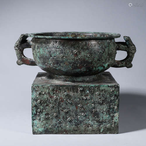 A kui dragon patterned bronze pot with beast shaped ears