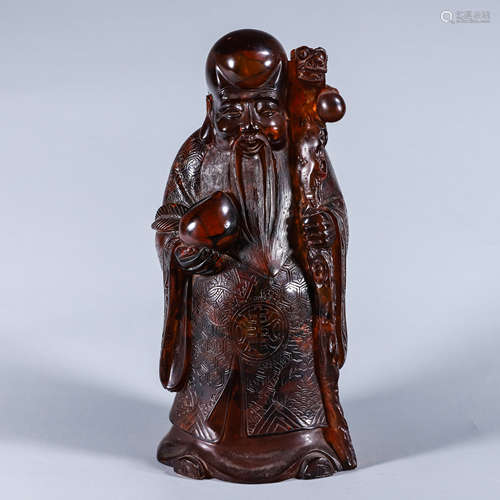 A carved figure ornament