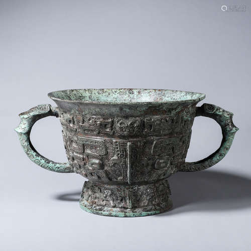 An inscribed taotie patterned bronze pot