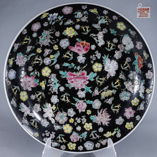 A black ground famille rose flower porcelain plate