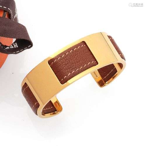 Hermès paris Bracelet rigide en métal doré ouvert entrelace ...