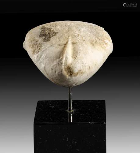 Marble head of huge idol of the Kiliya type.