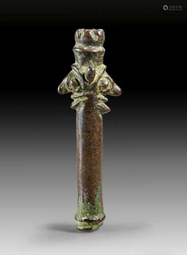 Bronze tube idol with janiform head.