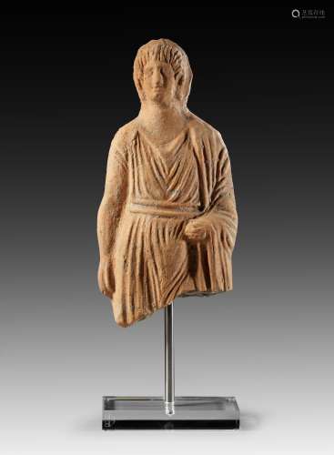 Etruscan terracotta votive figure of a male youth.