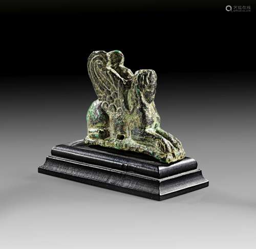 Graeco-Roman Bronze figurine of a lying female sphinx.