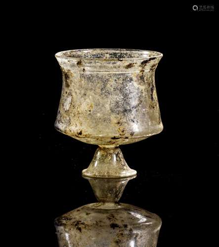Roman clear glass beaker in conical foot.