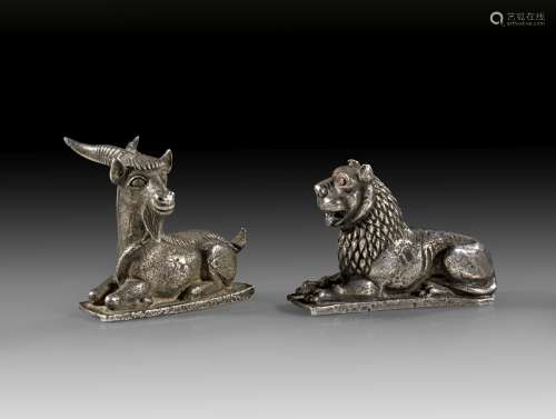 Cast silver lying lion and a lying wild goat.