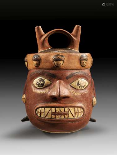 Moche stirrup vessel in form of a human head.