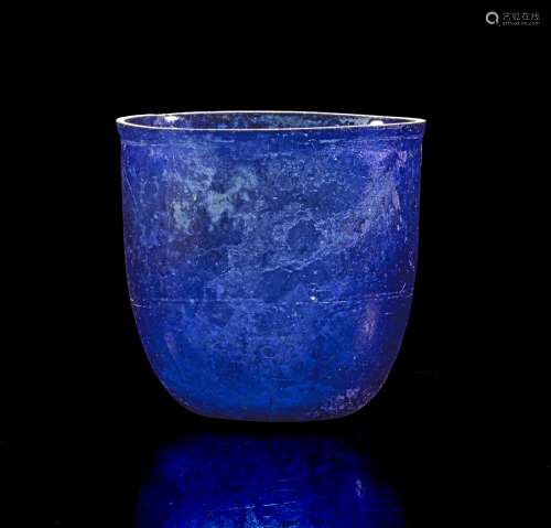 Blue glass beaker.