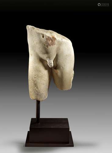 Marble torso of a slender ephebos.