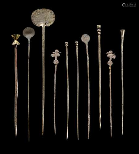Collection of silver robe pins.