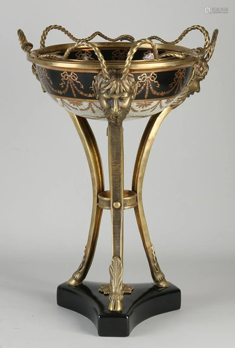 Ceramic table bowl with bronze and faun heads.