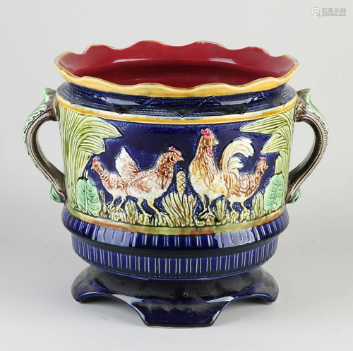 Antique majolica flower pot with ducks and chickens in