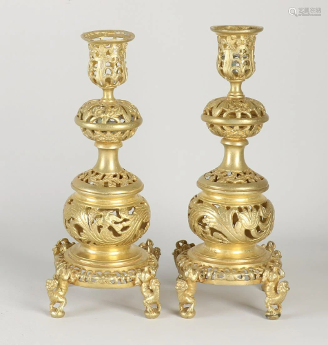 Two gilded brass neo renaissance candlesticks with