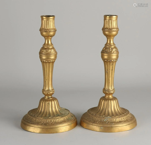 Two early 19th century fire-gilt bronze candlesticks.