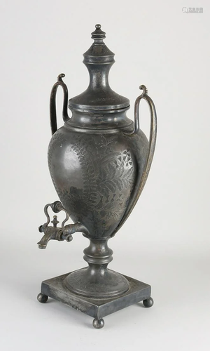 Antique plated brass tap jug with floral engraving.