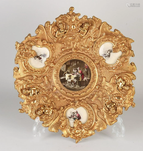 Heavy gold-plated brass wall dish in historicism style.