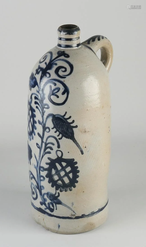 19th century German stoneware jug with floral decor.