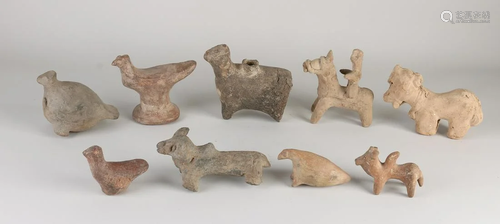 Nine antique terracotta figures, including two whistles