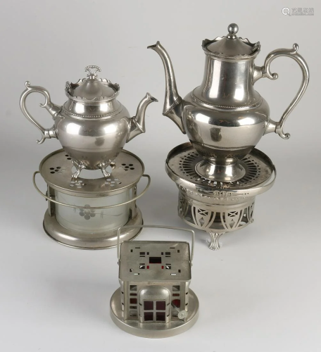 Three antique nickel-plated tea oven with two tea pots.
