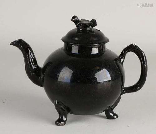 18th century black porcelain teapot with dove on lid.