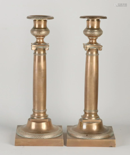 Two 19th century bronze Empire candlesticks. Circa