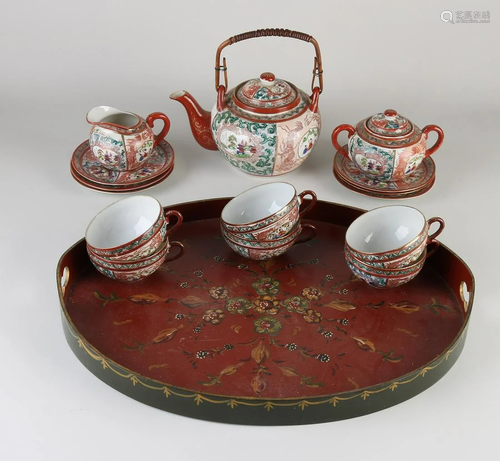 Antique Japanese eggshell porcelain tea set on a