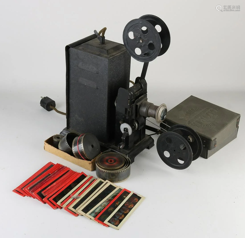 Antique tin film projector, with accessories. With