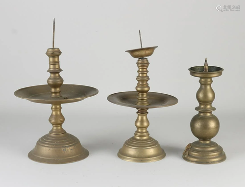 Three old/antique bronze candlesticks. 20th century.