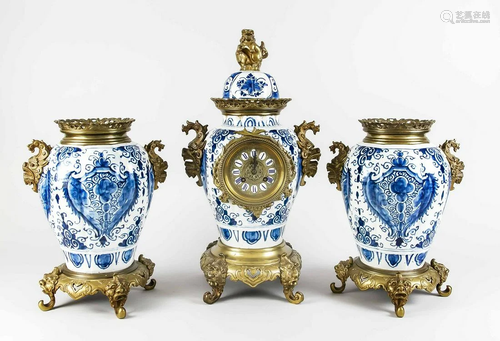 19th century clock set with 18th century Delft Fayence,