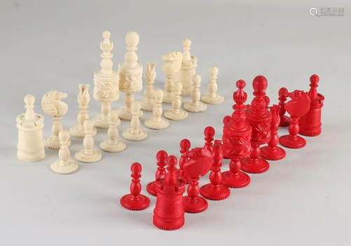 Antique bone chess pieces in mahogany box. Circa 1900.