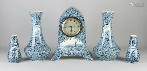 Antique five-piece ceramic clock set. Circa 1900.