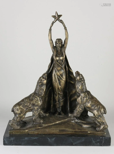 Bronze figure in Art Deco style on black marble base.