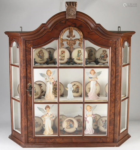 Walnut hanging display case full of 25 Goebel plates