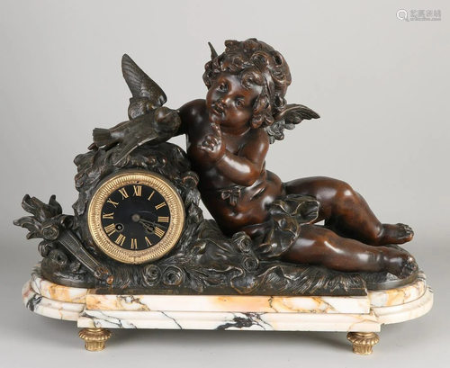 Large French mantel clock with bachus and bird. On