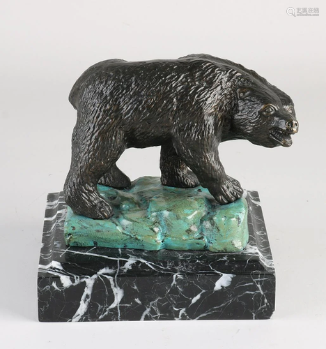 Antique bronze bear on marble base. Partly cold