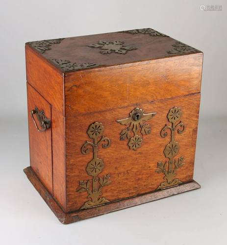 Antique oak English liqueur cellar with copper