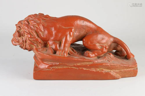 Antique terracotta lion. Signed Rako Zeilma.