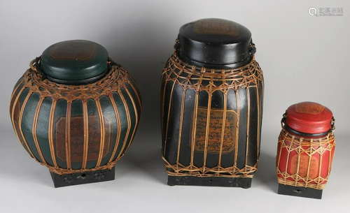 Three large wooden lidded boxes with Arabic