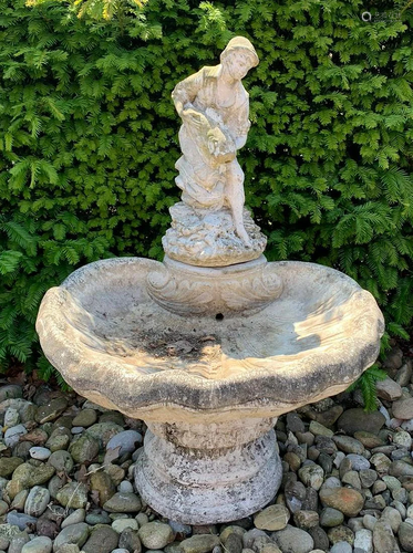 Concrete fountain with shell-shaped receptacle