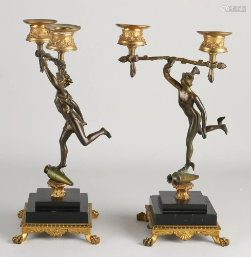 Two 19th century French bronze candlesticks, partly