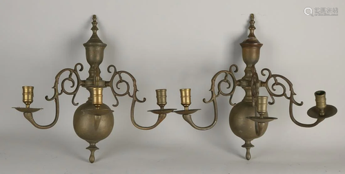 Two antique Dutch bronze wall sconces in Baroque style.