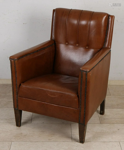 Old English arm chair with cognac leather upholstery