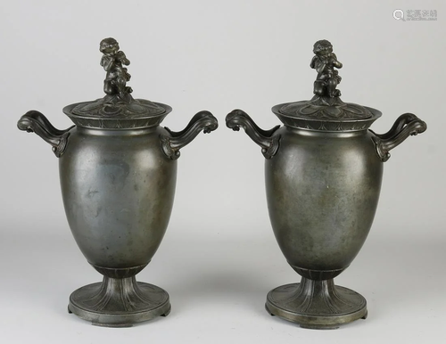 Two antique pewter lidded jars with Amor. Circa 1900.