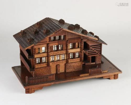 Antique Swiss music box in the shape of a chalet. Circa