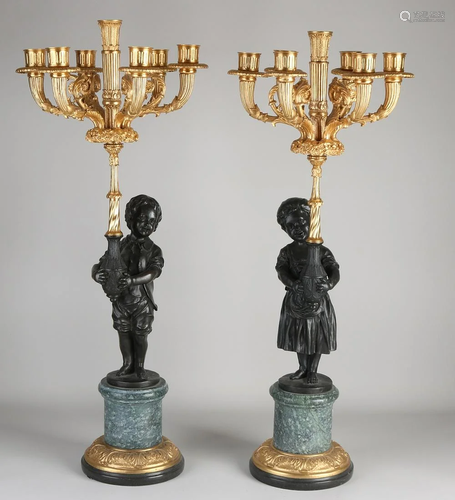 Two large bronze and marble candlesticks, with gilding