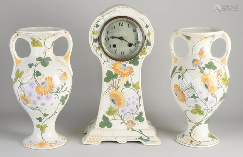 Three-piece Dutch Gouda polychrome plate clock set.