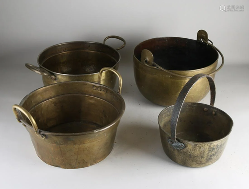 Four large antique brass pans with handles. 19th